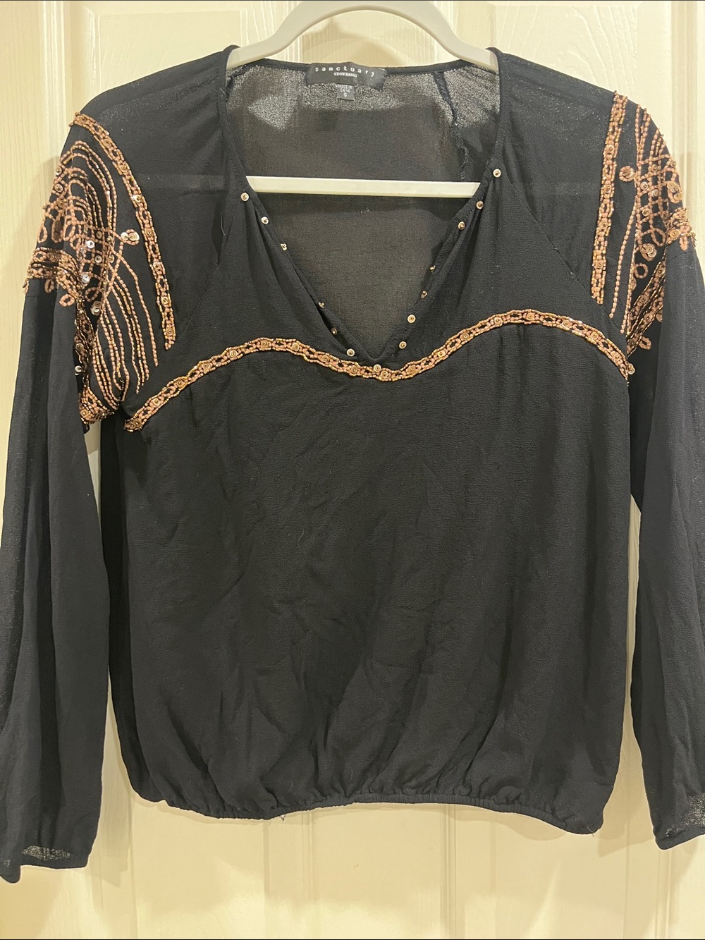 Black blouse with gold embellishments
